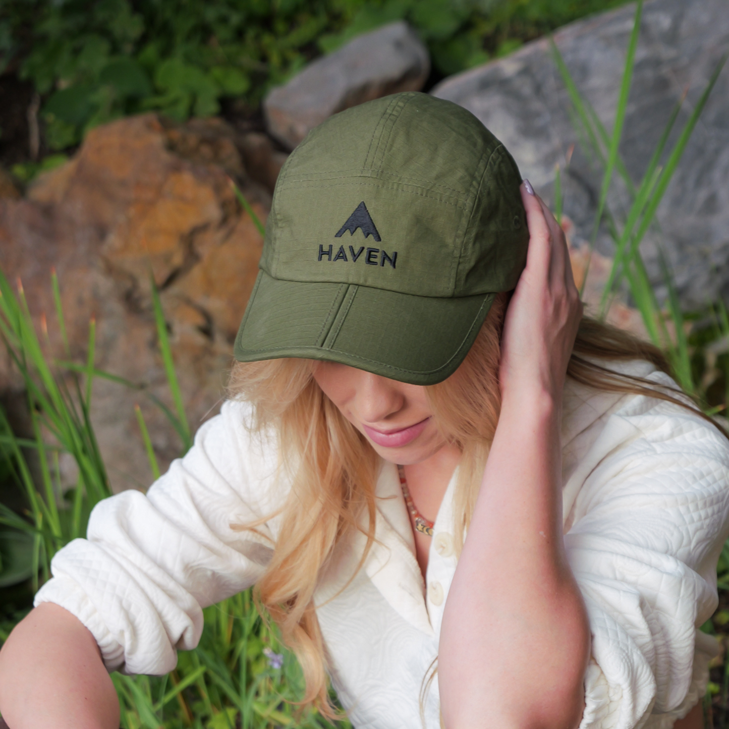Girl wearing green foldable hat