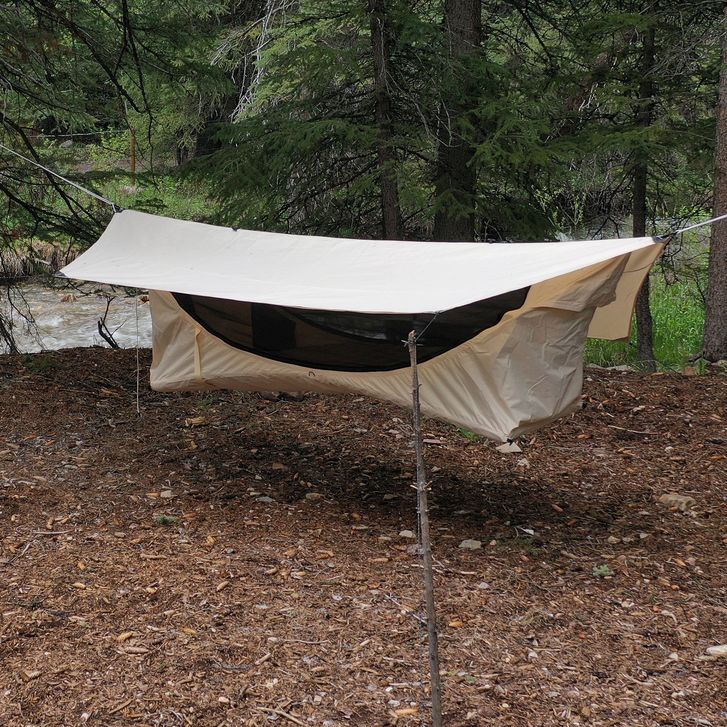 Haven Safari glamping hammock by a river