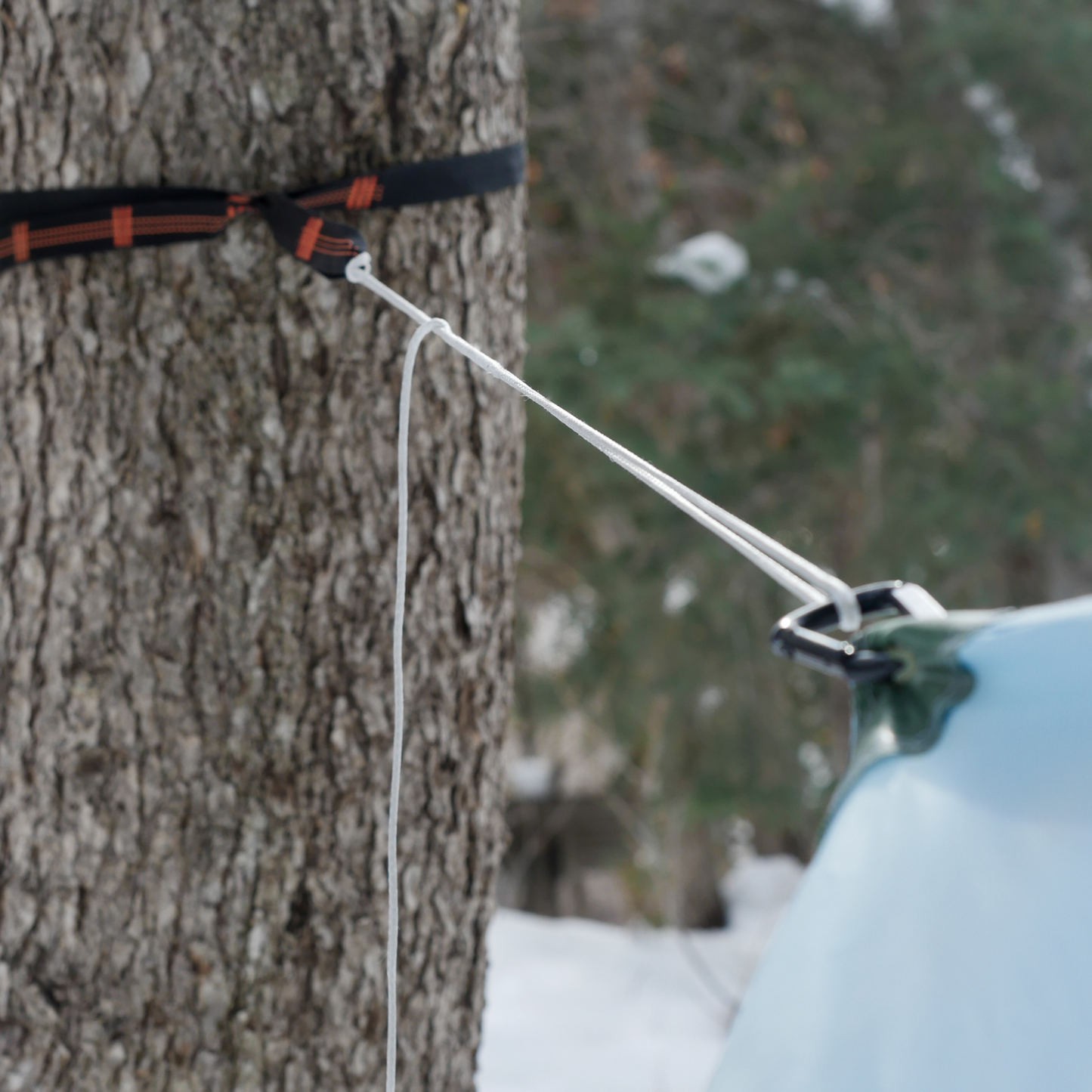 Lightweight sling attached to a camping hammock