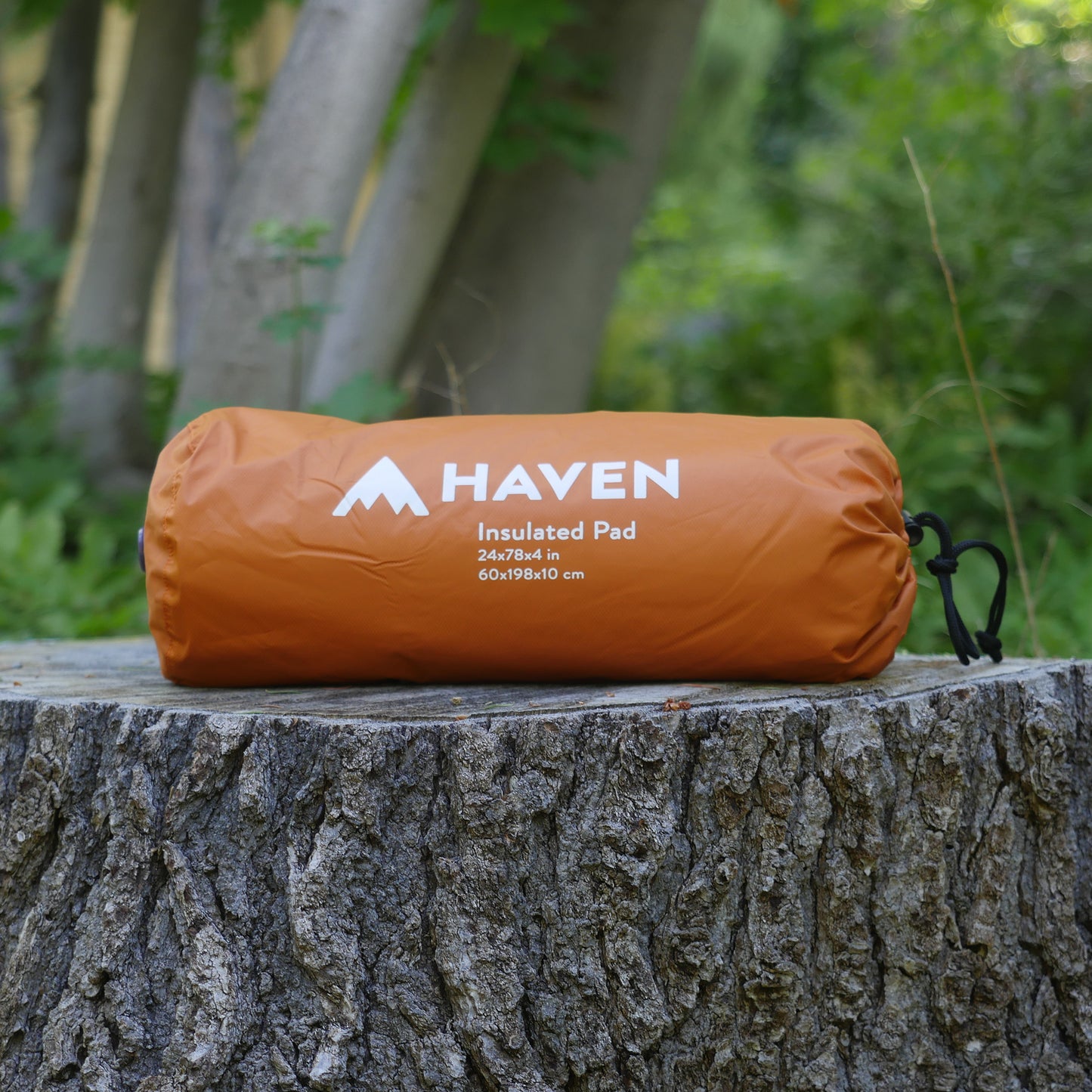Orange insulated sleeping pad for camping hammock